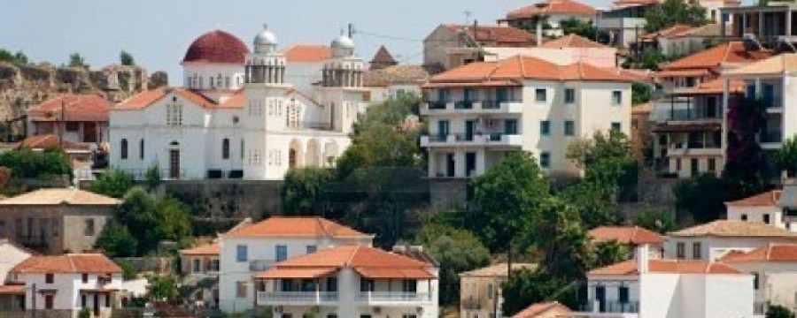 6677343-greek-village-koroni-with-buildings-exterior-in-landscape-354c939f34